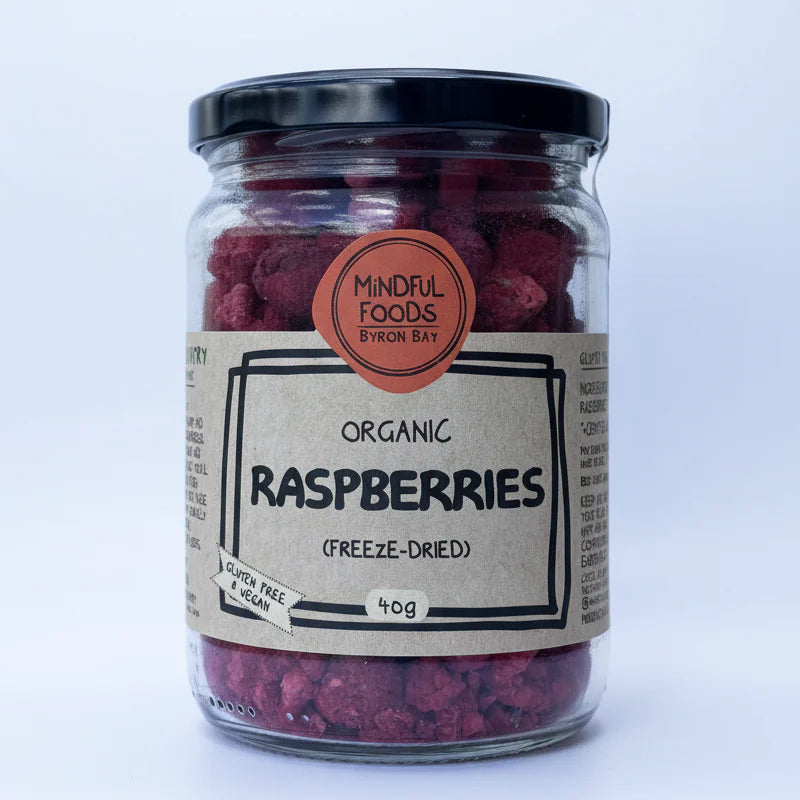 Jar of freeze-dried raspberries with a label on a white background